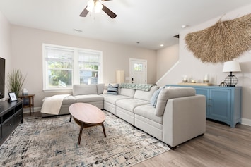 Living room with large sectional and smart TV