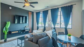 Business Suite, Balcony | Living area | 55-inch Smart TV with digital channels