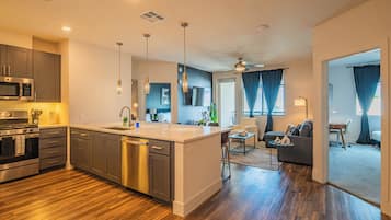 Exclusive Suite, Balcony | Living area | 55-inch Smart TV with digital channels