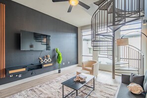 Panoramic Condo | Living area | 55-inch Smart TV with digital channels