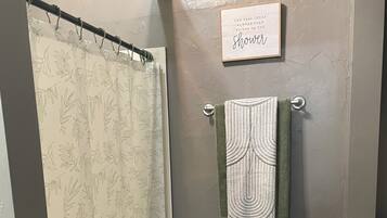 Shower, jetted tub, hair dryer, towels