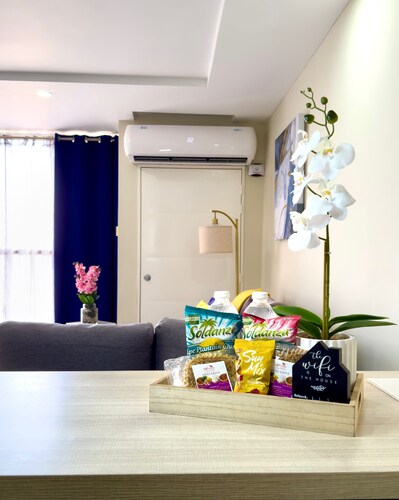 Gated 1-bedroom Condo in Portmore with AC, WiFi, Pool, Kitchen, TV, Beach View