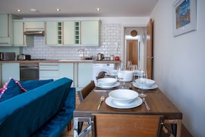 Microwave, oven, toaster, dining tables