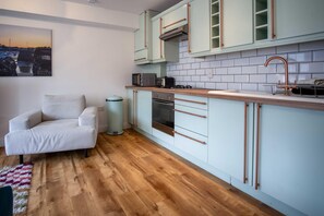 Microwave, oven, toaster, dining tables