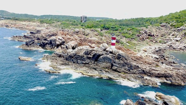 A rocky coastline with a lighthouse.