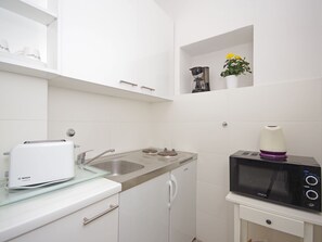 Fridge, microwave, cookware/dishes/utensils