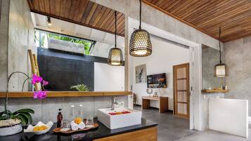 Separate bathtub and shower, towels, soap, shampoo