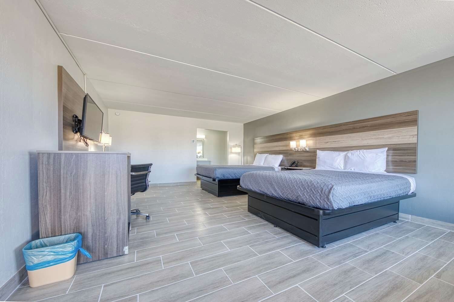 Stretch out in an open layout with two beds and lounge space.