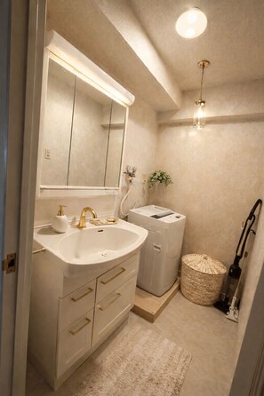 Hair dryer, towels, soap, toilet paper