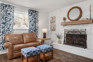 Fireplace nook with a leather sofa - Secret Garden | 8BR•Game Room•Fire Pit & Waffles! (Orem)