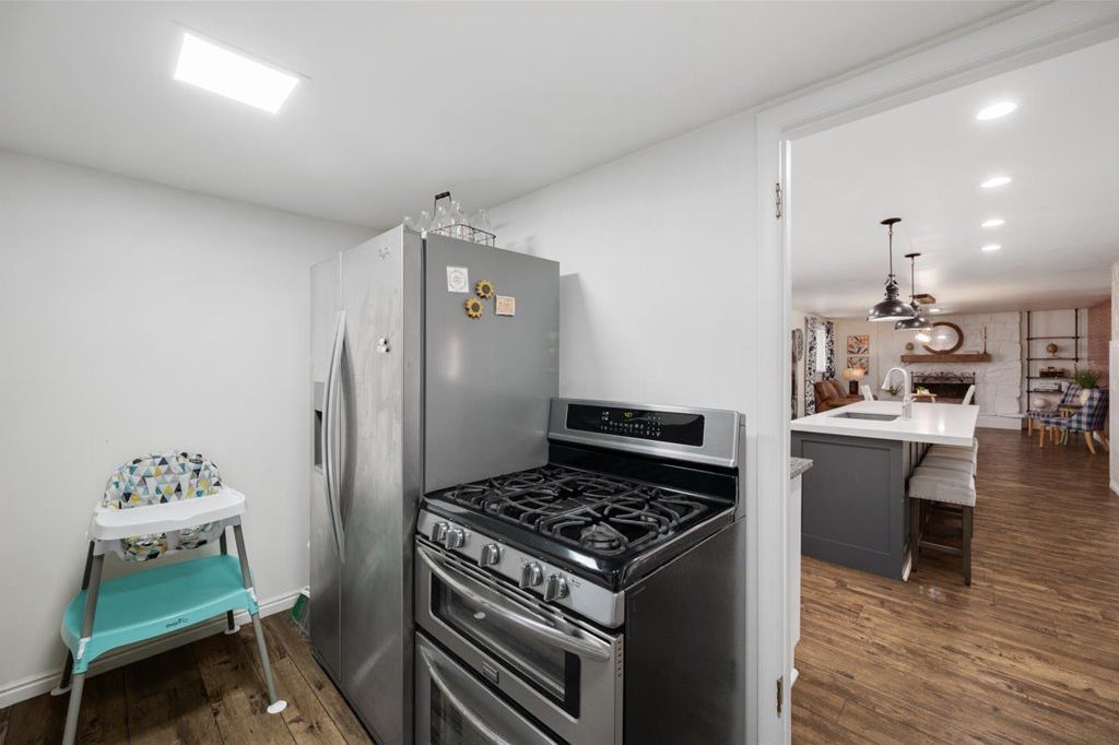 Second kitchen with a fridge and double-oven gas range