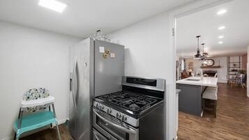 Second kitchen with a fridge and double-oven gas range