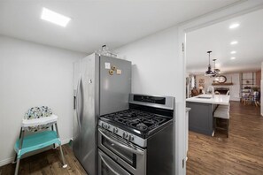 Second kitchen with a fridge and double-oven gas range - Secret Garden | 8BR•Game Room•Fire Pit & Waffles! (Orem)
