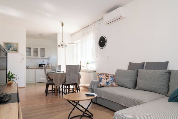 Family Apartment, Multiple Bedrooms (Spacious 2 Bedroom Apartment With) | Living area | Flat-screen TV