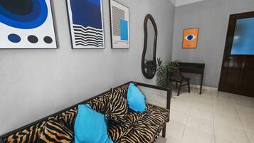 Sitting area with modern art and a zebra-print sofa