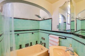 A bathroom with a bathtub, sink, and shower. - 1 Mi to Ocean! Home w/ Rooftop Deck in Long Beach (Long Beach)