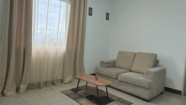Living area - Charming 1-bedroom condo in front of SM South Mall.  (Las Piñas)