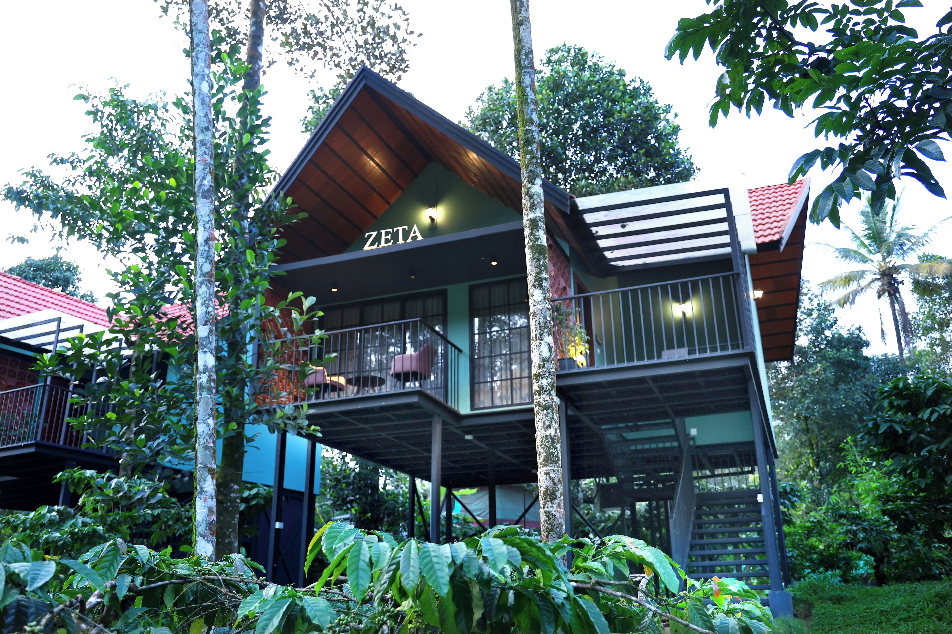 A modern multi-story building with a sign reading "ZETA".