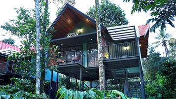 A modern multi-story building with a sign reading "ZETA".
