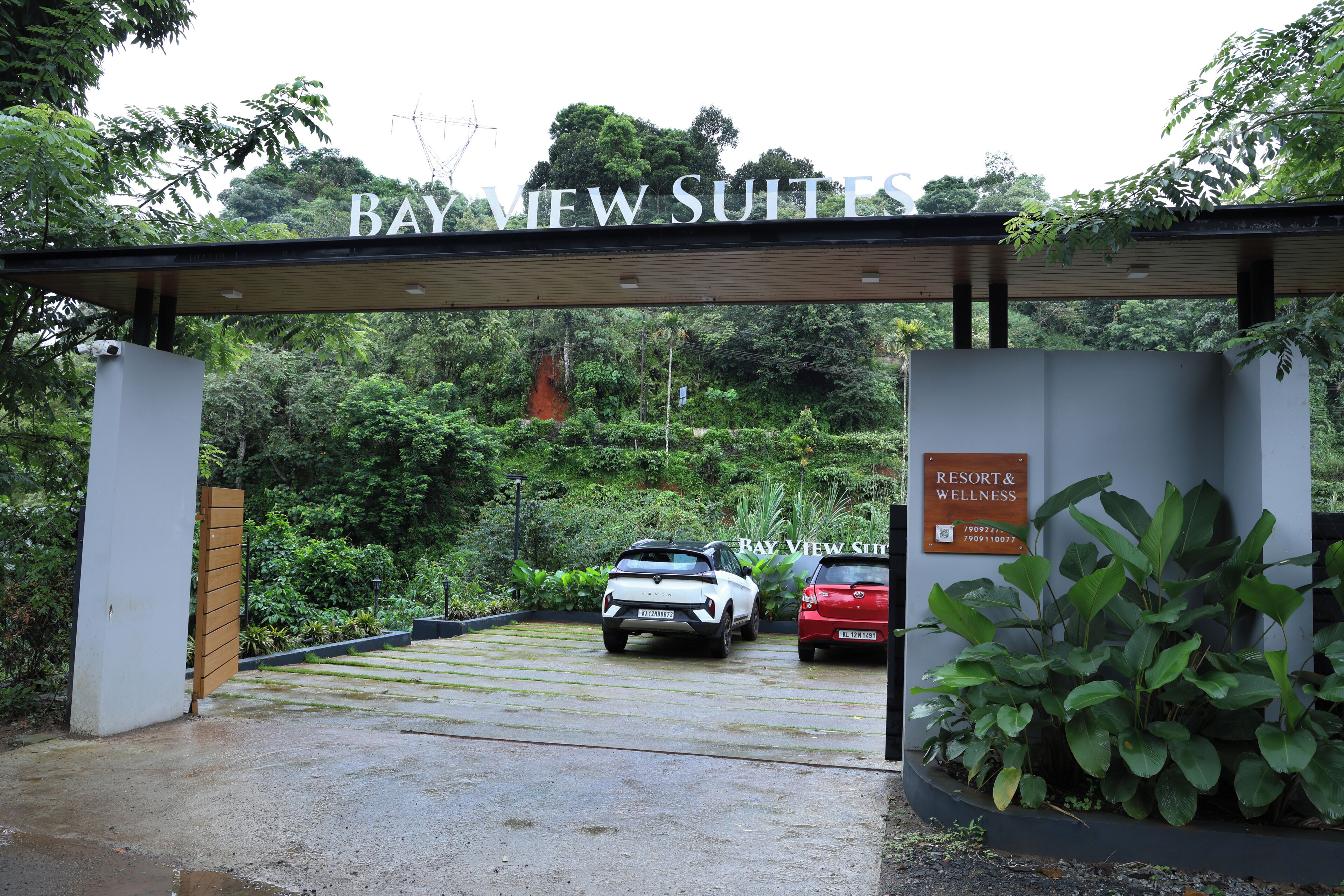 A gated entrance to Bay View Suites with a sign indicating the resort and wellness area.