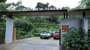 A gated entrance to Bay View Suites with a sign indicating the resort and wellness area.
