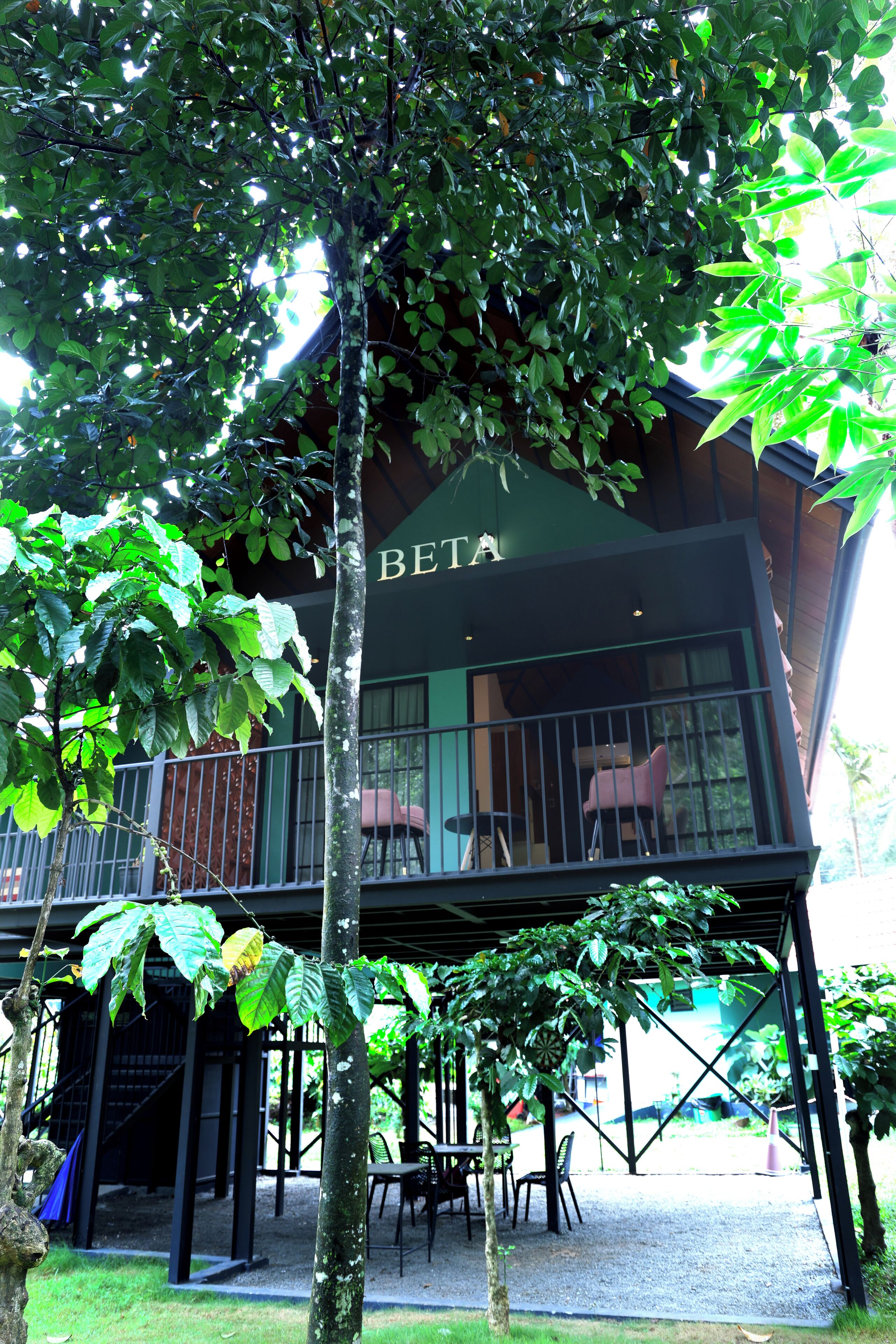 A building with a balcony and outdoor seating area.