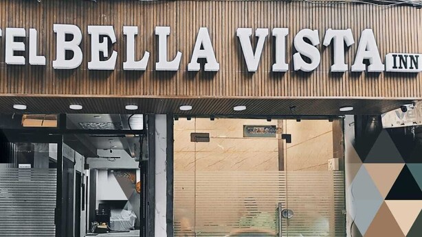 The exterior of Hotel Bella Vista Inn with a wooden facade and large signage. - Hotel Bella Vista Inn (Amritsar)