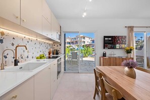 Fridge, microwave, oven, stovetop - Chic Oasis Poolside Residence by Nomads (Paphos)