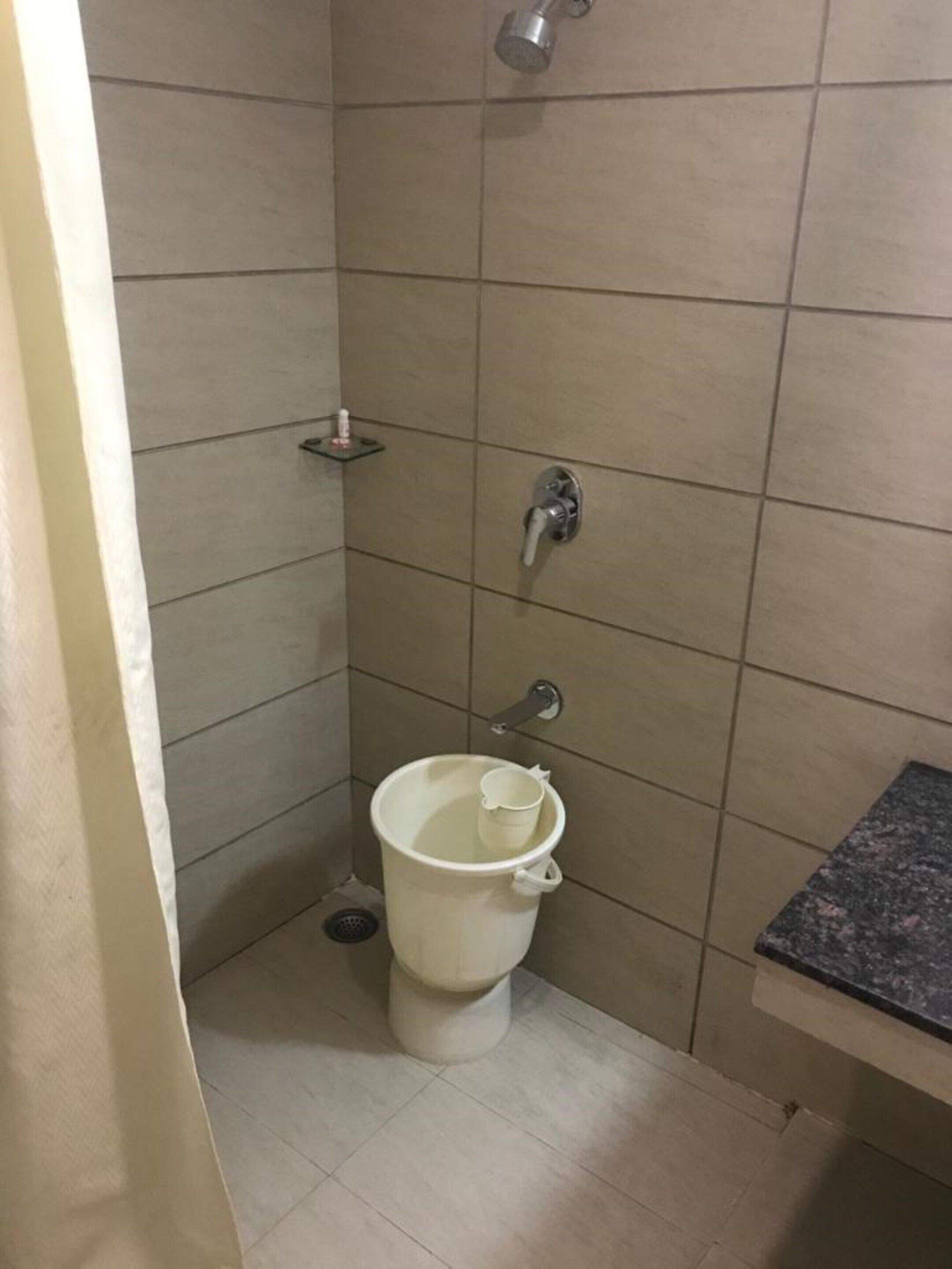 Shower, rainfall showerhead, towels, soap