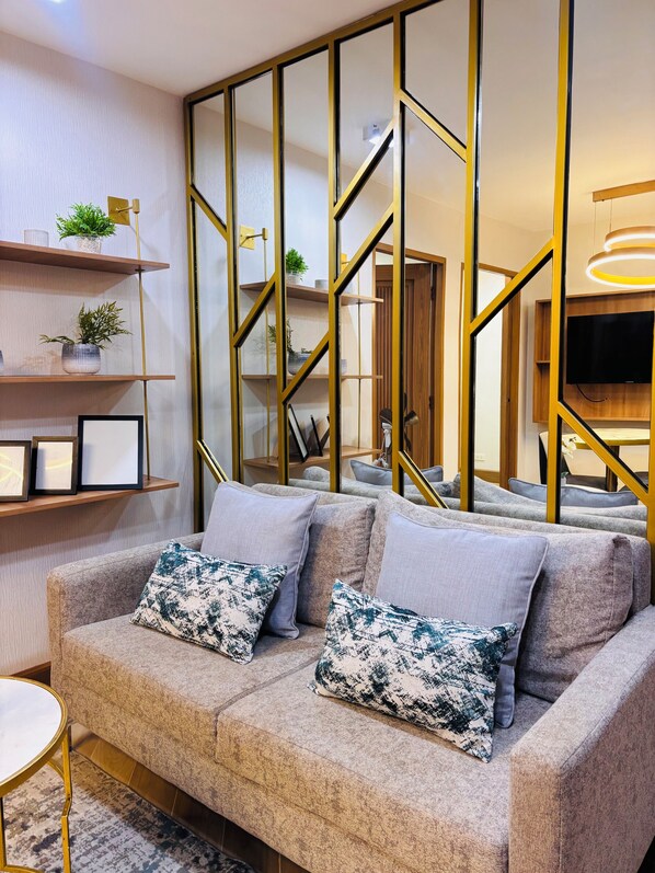 Comfort Condo, 2 Bedrooms, Pool Access | Living room | 32-inch Smart TV with digital channels - One Spatial Iloilo (Iloilo)