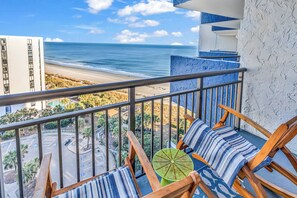 A balcony with a view of the beach and ocean. - Bluewater Resort Condos (Myrtle Beach)