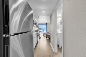 Signature Condo, 1 Bedroom, Ocean View, Beachfront | Private kitchen | Fridge, microwave, oven, stovetop - Bluewater Resort Condos (Myrtle Beach)