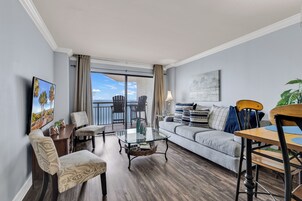Family Condo, 2 Bedrooms, Pool Access, Beach View | Living room | 50-inch Smart TV with digital channels