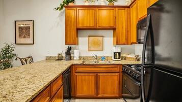 Coffee/tea maker, fridge, microwave, oven