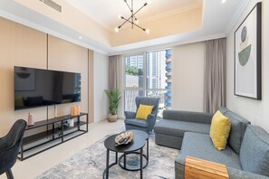 Family Apartment, 1 Queen Bed with Sofa bed | Living area | 42-inch Smart TV with digital channels, Netflix, streaming services - Heaven Crest Vacation Homes Downtown - Studio, 1, & 3 Bedroom Suites 2 minute walk to Dubai Mall and Burj Khalifa (Dubai)