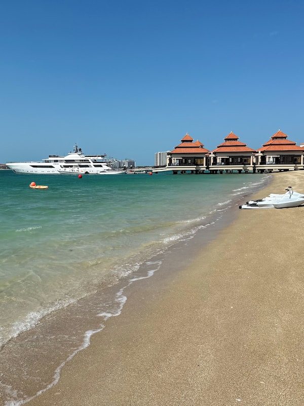 On the beach, sun-loungers, beach umbrellas, beach towels
