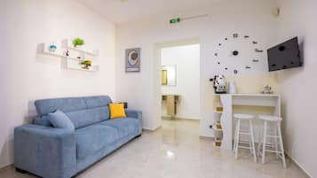 Luxury Apartment, City View | Living area | 55-inch LED TV with digital channels