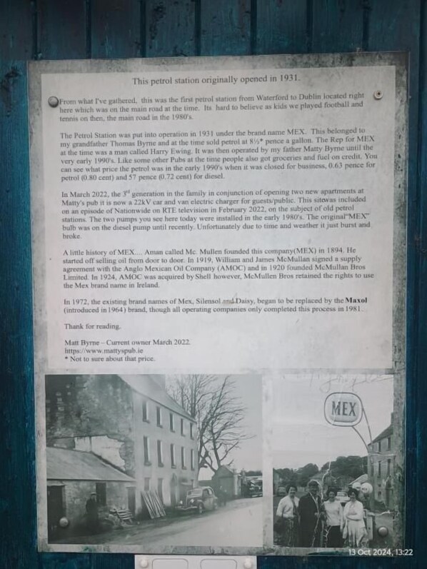 A historical document detailing the history of a petrol station opened in 1931, including its operation under the brand name MEX and its transition to a 22kV car and van electric charger. - Mattys Pub & Apartments (Muine Bheag)