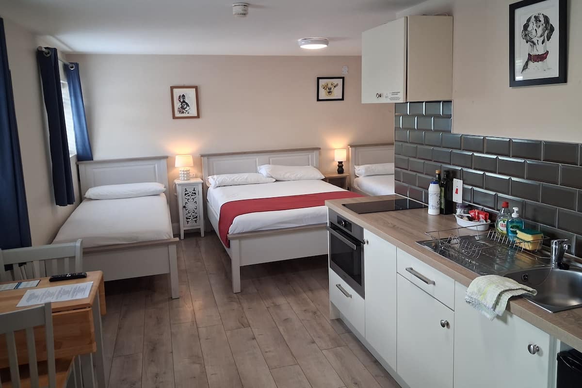Comfort Quadruple Room | Premium bedding, desk, laptop workspace, iron/ironing board