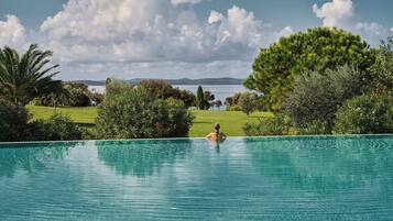 Outdoor pool, free cabanas, pool umbrellas