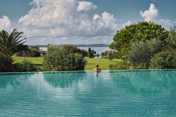 Outdoor pool, free cabanas, pool umbrellas