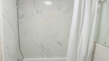 Studio | Bathroom | Shower, hair dryer, towels