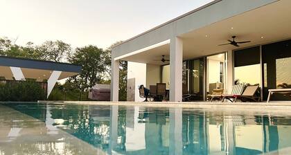 This stunning home offers a perfect blend of luxury and natural beauty.