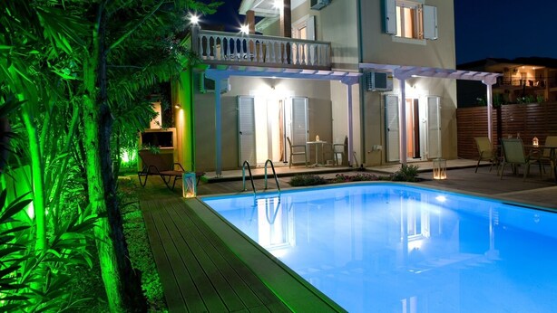 A two-story house with a swimming pool, outdoor seating, and a balcony. - Stunning 2-bed House in Lefkas (Lefkada)