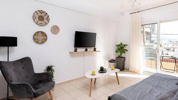 Comfort Apartment, Sea View | Living area | 32-inch Smart TV with cable channels, Netflix, streaming services