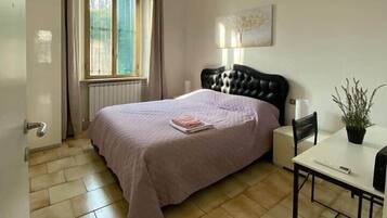 1 bedroom, desk, iron/ironing board, travel crib