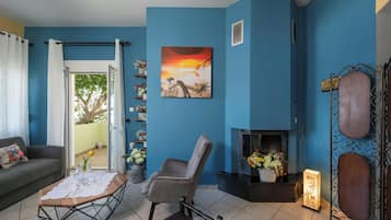 Comfort House, Sea View | Living area | 50-inch Smart TV with digital channels