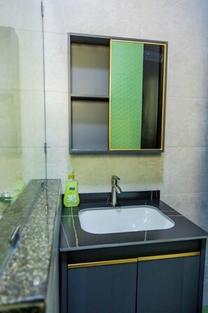 Economy Apartment, City View | Bathroom | Shower, towels, soap, shampoo