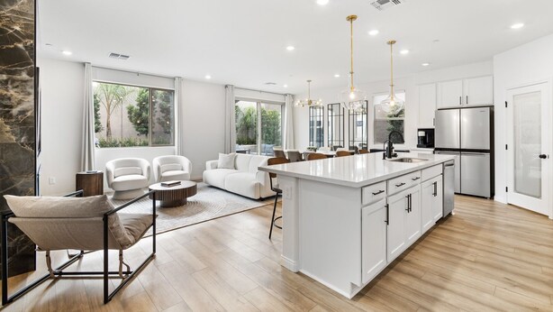 A modern kitchen with white cabinetry, a central island, stainless steel appliances, and pendant lighting. - Gated,new 5bed home in Vegas Summerlin (Red Rock Casino area),w/ Hot Tub,BBQ,etc (Las Vegas)