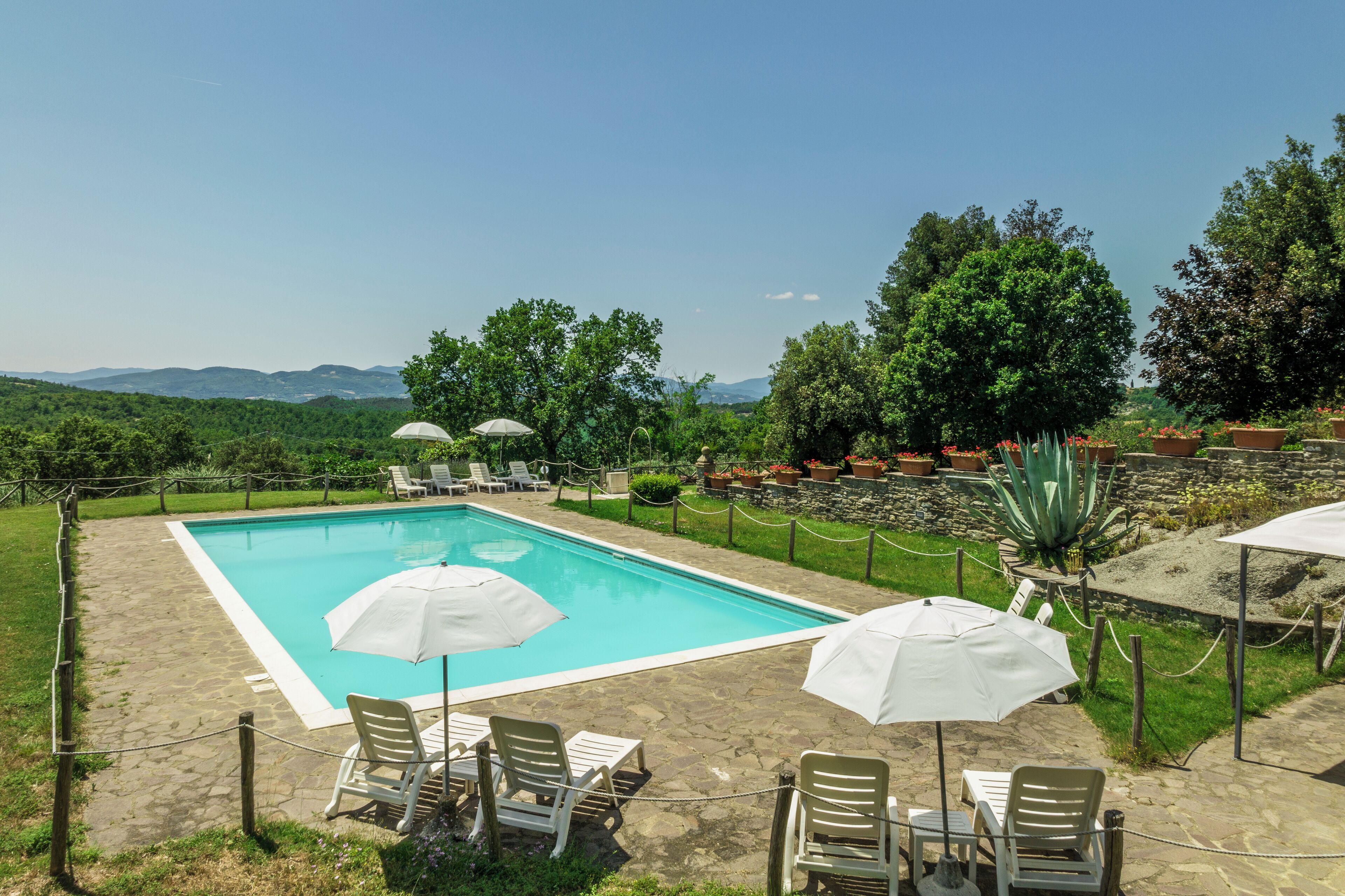 Seasonal outdoor pool, open 8:00 AM to 8:00 PM, pool umbrellas